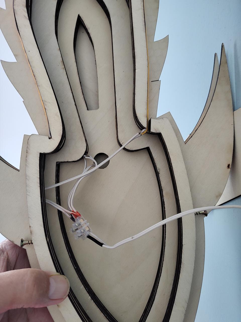 The inside of the shell, showing the wiring loom, and how the terminal block holds everything together.