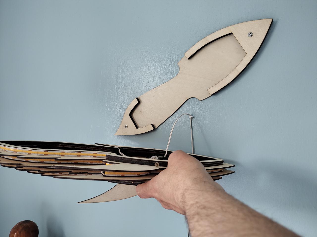 The wall plate screwed to the wall at a jaunty angle.