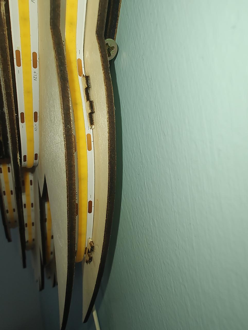 Small retaining wood lugs to keep the COB LED strip in place.